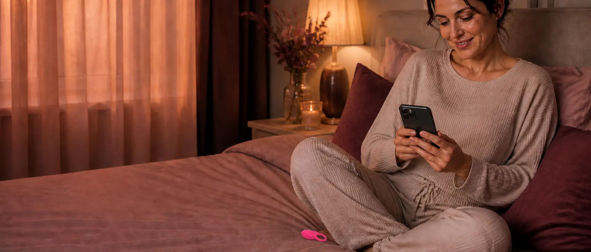 Woman enjoying a quiet evening with her phone and the bestselling Magic Flamingo nearby