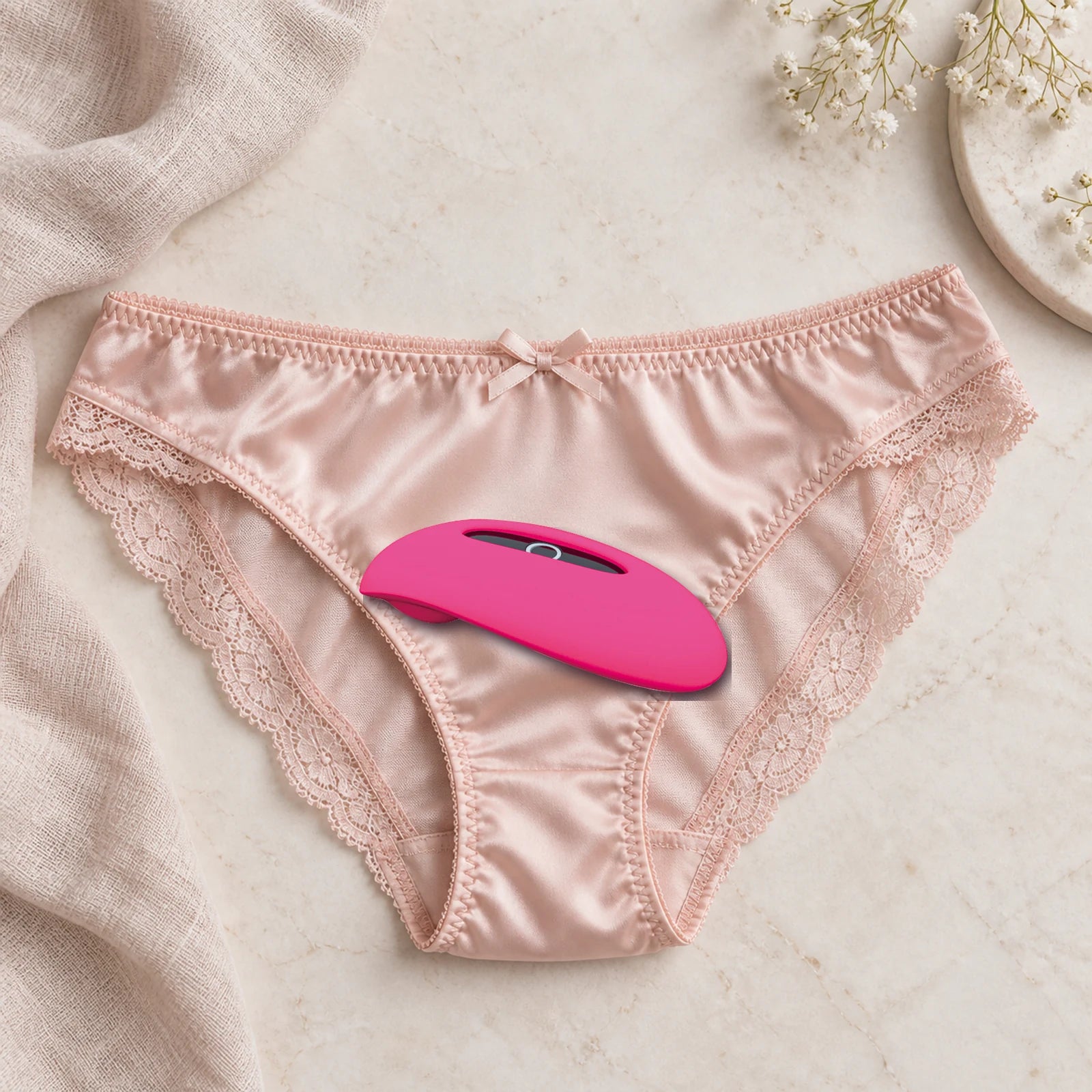 Magic Candy wearable vibrator resting on satin underwear