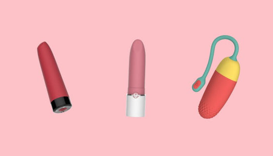 Three pink and red bullet vibrators on a pink background.