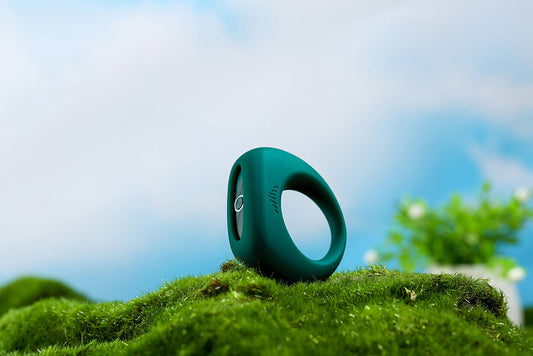 Green Magic Motion cock ring on moss.