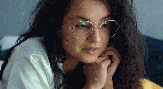 Close-up of a woman wearing glasses.