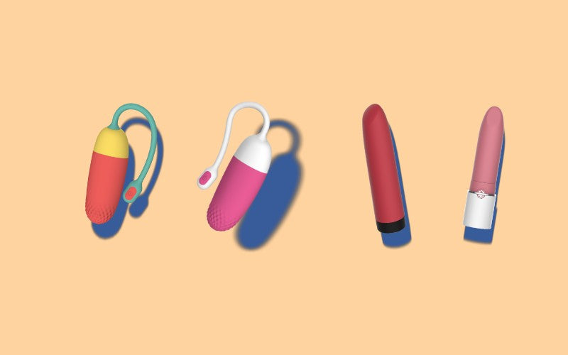 Four bullet vibrators on a beige background.