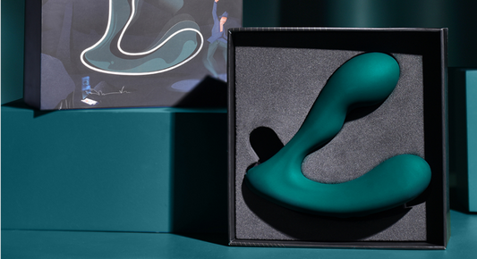 Dark green Solstice X prostate massager in its box.