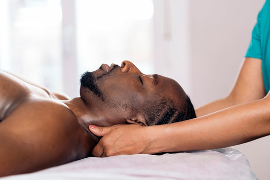 Person receiving a neck massage.