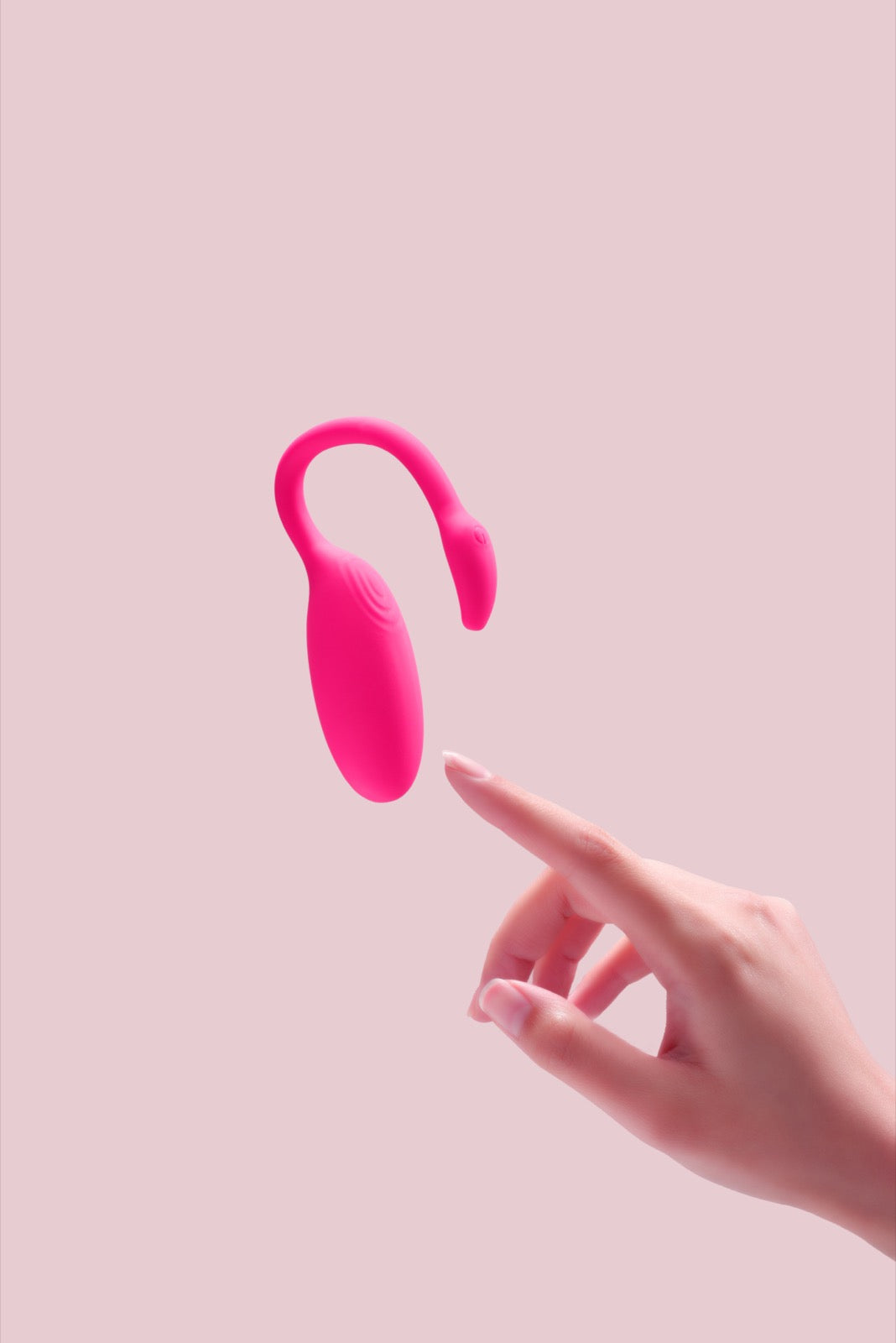 Magic Flamingo wearable vibrator near one hand for app and manual control