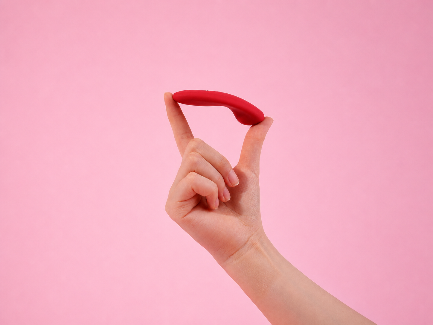 Magic Nyx slim external wearable shown balancing across two fingers