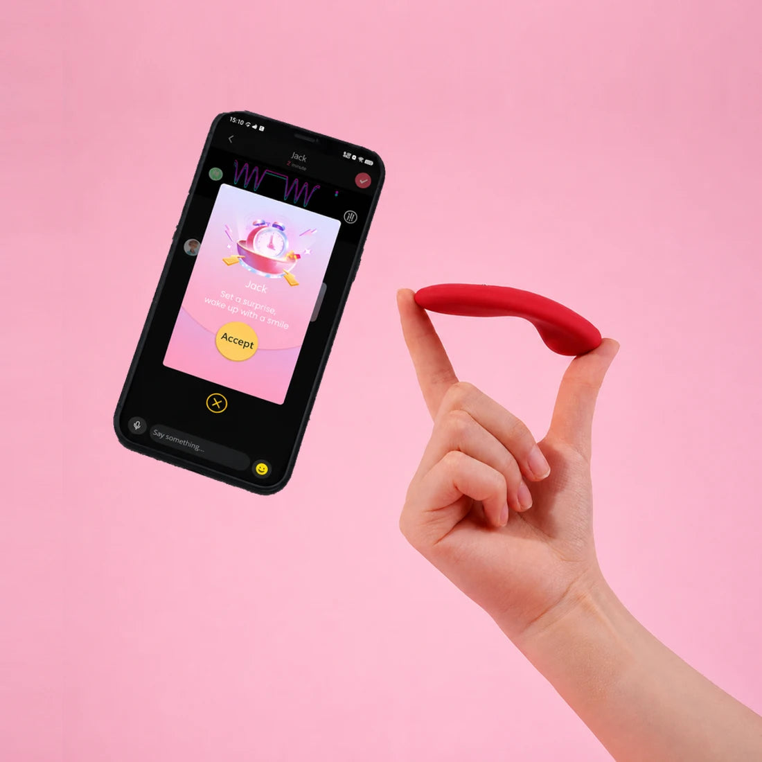 Two fingers holding red Magic Nyx to show its slim profile beside the Magic Motion app