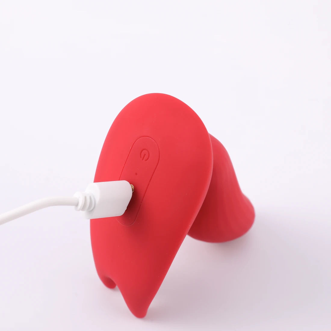 Close-up of the magnetic charging cable connected to red Magic Umi